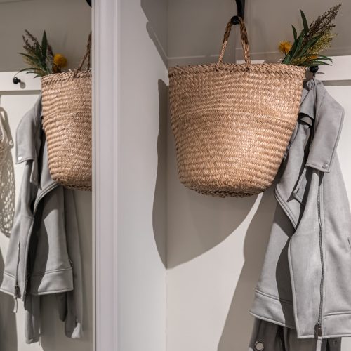 Place for outerwear in the hallway, hooks for hanging, home interior.